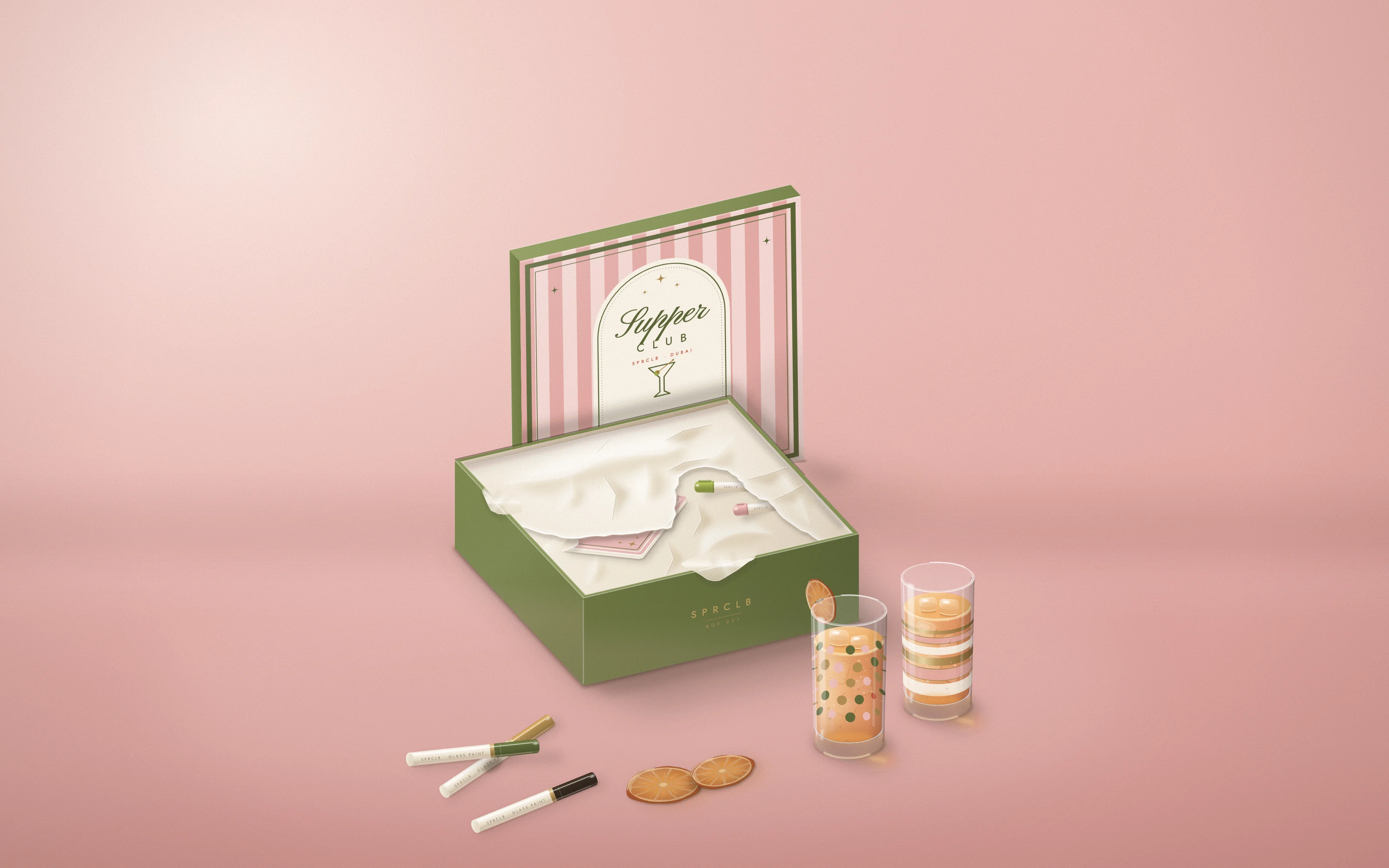 The Original: Box 001 open on a blush backdrop, its striped lid propped behind, two painted highball glasses of spritz beside it