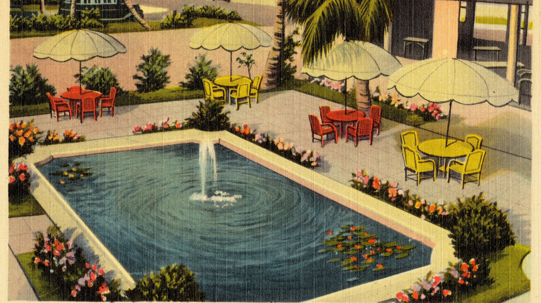 A vintage postcard of the patio pool at the Hotel Seaglade, Palm Beach, with a fountain, yellow umbrellas and flower beds